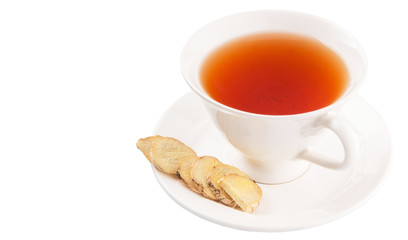 Ginger slices and a cup of tea over white background