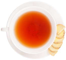 Ginger slices and a cup of tea over white background