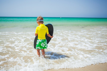 Fototapeta na wymiar Surfing boy