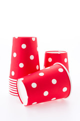 Red polka dot paper cup isolated on white background