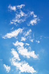 Fototapeta na wymiar little white clouds in september blue sky