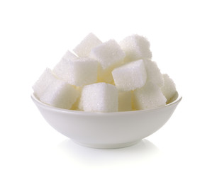 Sugar cubes in a bowl isolated on white background