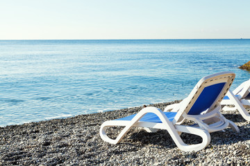Obraz premium chairs on urban Massandra pebble beach in Yalta