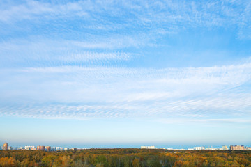 blue afternoon sky over residential district