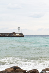 jetty with lighthouse in Yalta city