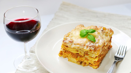 Fresh lasagna with meat and basil