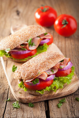 sandwich with ham tomato and lettuce