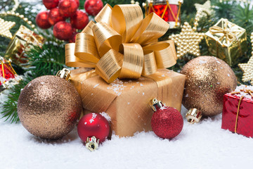Golden gift box and Christmas tree decorations