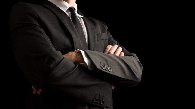 Confident Businessman Crossing Arms on Front