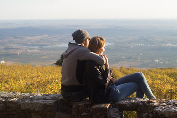 Couple enjoying sunset in countryside