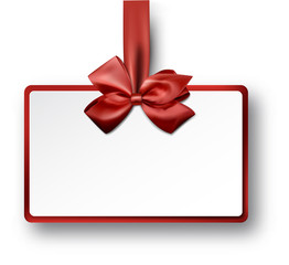 White paper gift card with red satin bow.