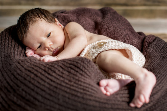 portrait of a cute sleepy newborn