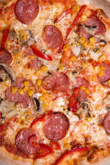 Tasty Italian pizza with pepperoni and mushrooms