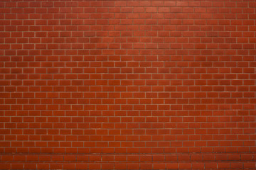 Red brick wall suitable for a background.