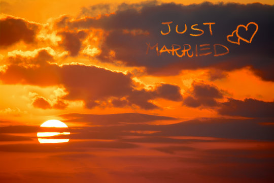 just married written at sunset
