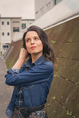 Pretty girl posing in the city streets