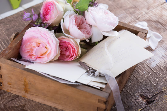 Box With Flowers  And Old Photos