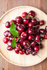 Top view group of many fresh cherries in basketwork