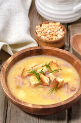 Pea soup on rustic table