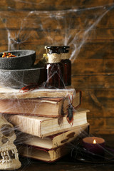 Frightful still life for Halloween, on wooden background