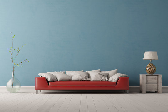 Rotes Sofa vor blauer Wand