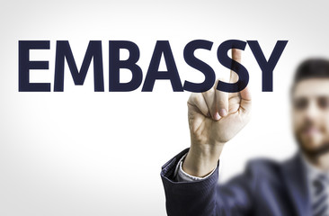 Business man pointing the text: Embassy