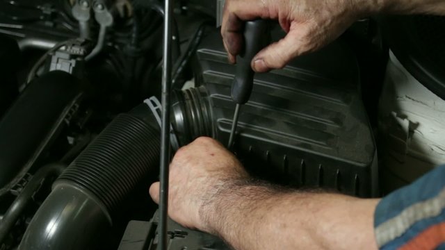 Car Repair Mechanic Screwing Automobile Air Filter