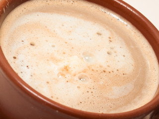 Cup of cappuccino coffee. extreme macro