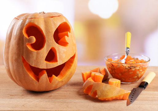 Hollowing out pumpkin to prepare halloween lantern