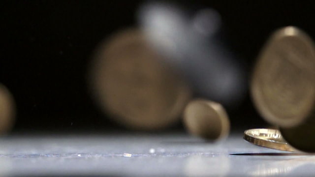 Coins fall on the table
