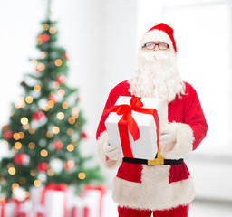 man in costume of santa claus with gift box