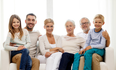 happy family sitting on couch at home
