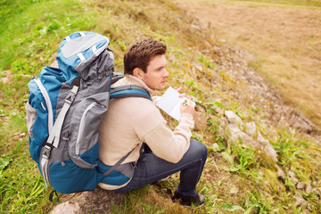 man with backpack hiking