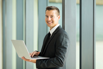 Fototapeta premium young businessman using laptop computer