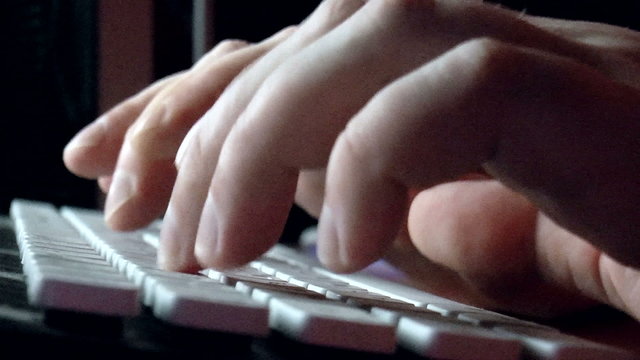The video shows hands writing on keyboard, close-up shot