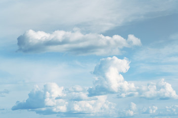 White fluffy clouds in blue sky