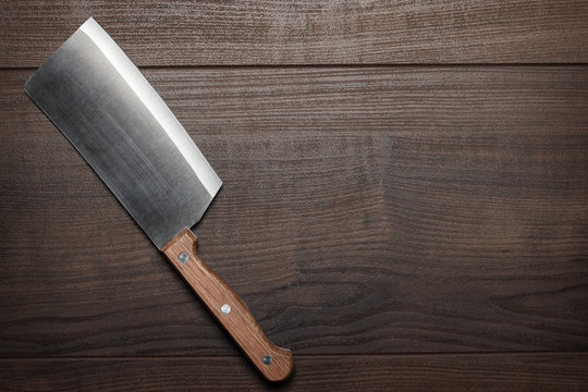 kitchen knife on the brown wooden table