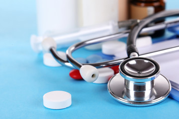 Stethoscope, pills and bottles