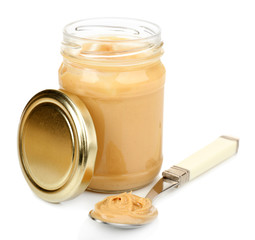 Creamy peanut butter in jar, isolated on white