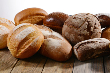 Fresh bread on table on white background
