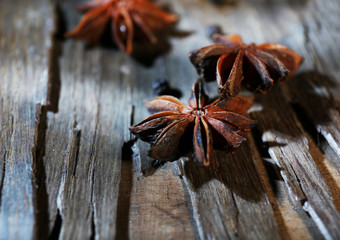 Star anise on dark wooden background, close-up