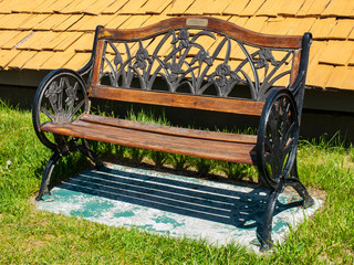 Metal and Wood Park Bench on a Sunny Day