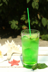 Refreshing cocktail on table, outdoors
