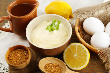 Mayonnaise ingredients on wooden background