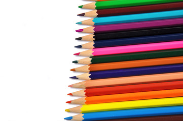 Assortment of colored pencils over white