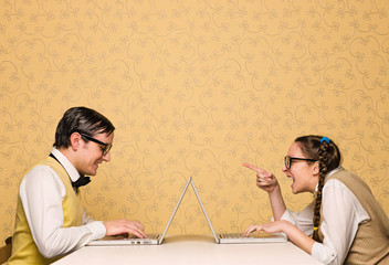 Young nerds sitting at the desk