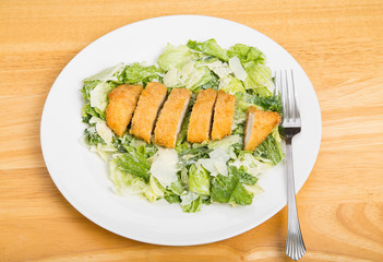Sliced Chicken on Caesar Salad