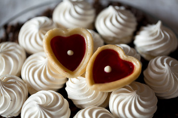 French vanilla meringue cookies and two sweet hearts