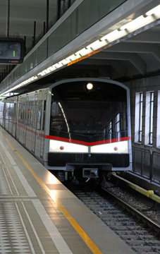 futuristic subway arrives at the train station