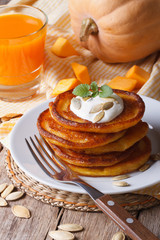 Fototapeta na wymiar Pumpkin pancakes and juice closeup